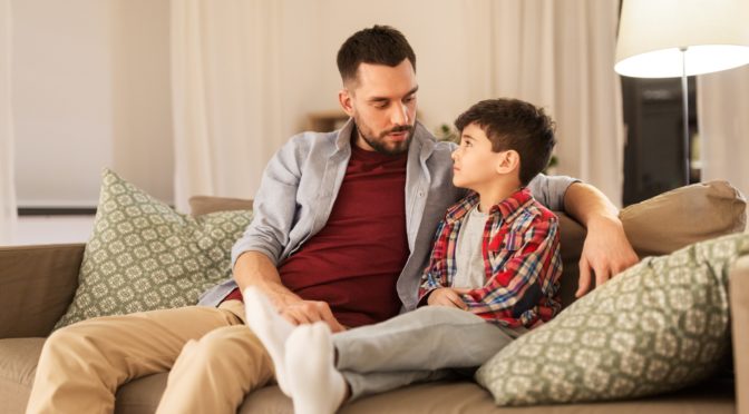 a father having a serious talk with his son