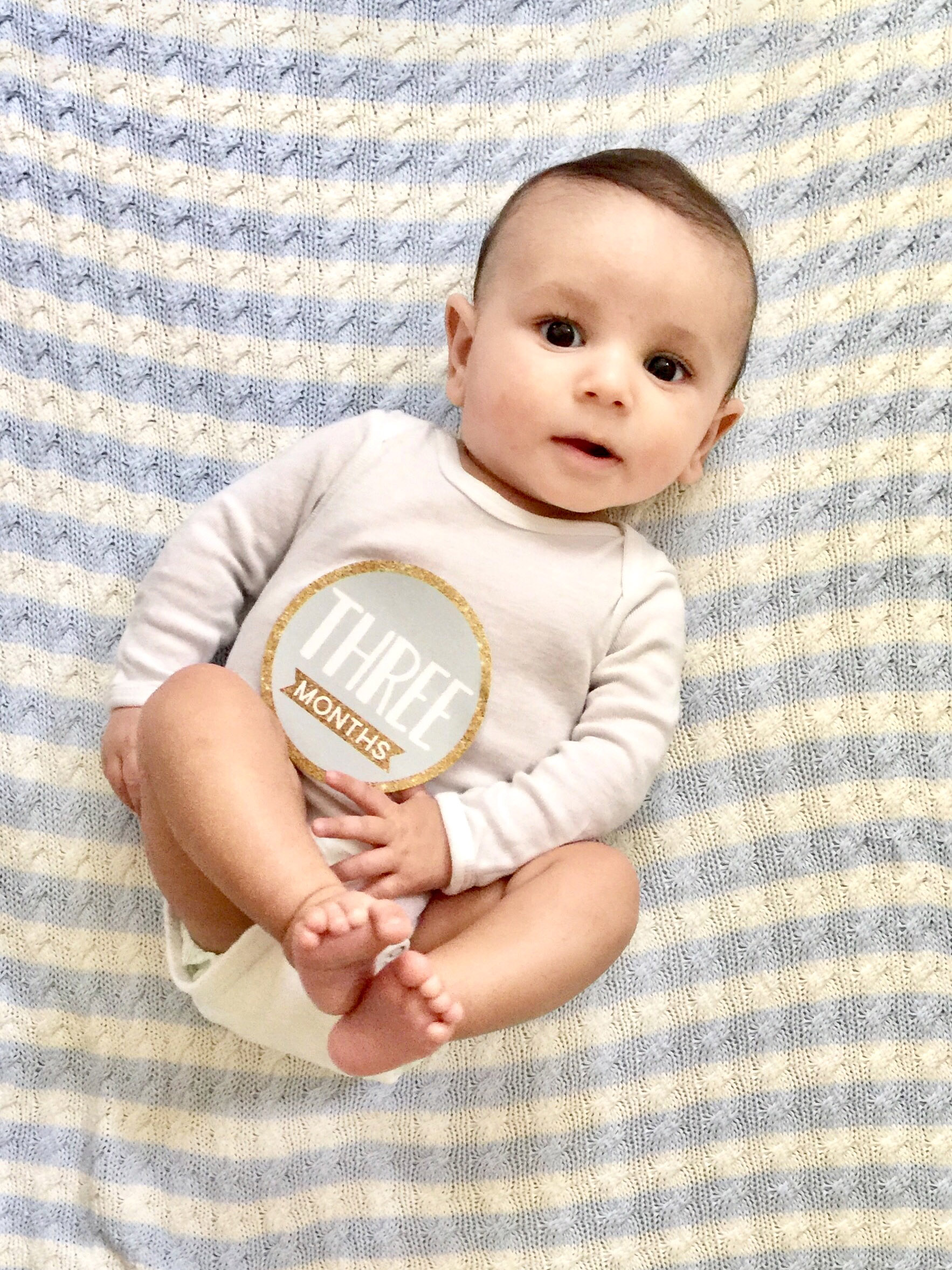 portait of CHOC patient Andre at three months old in bed