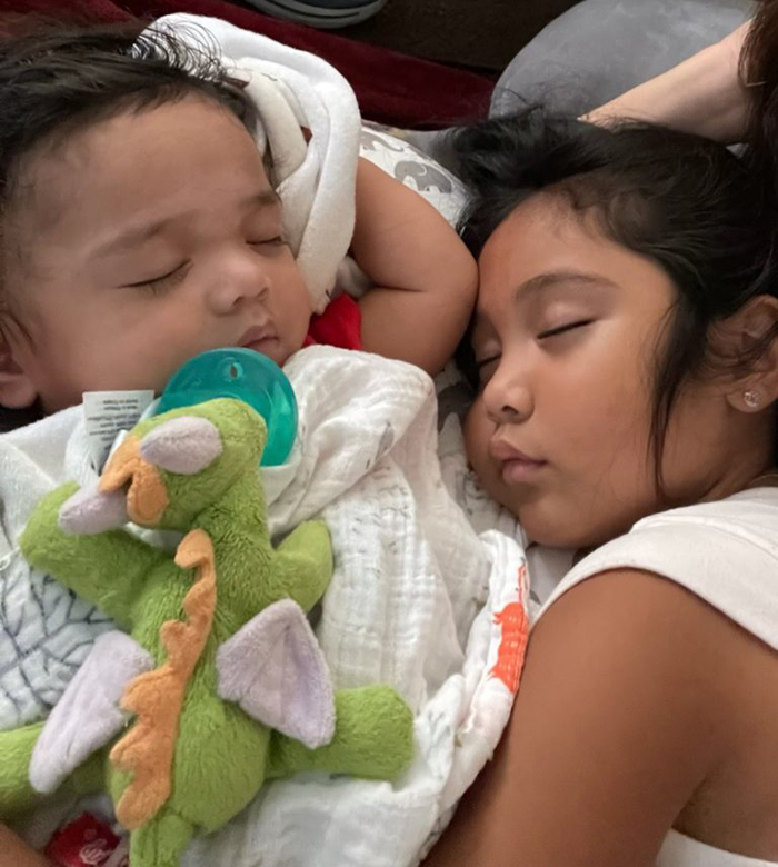 baby and sibling sleeping