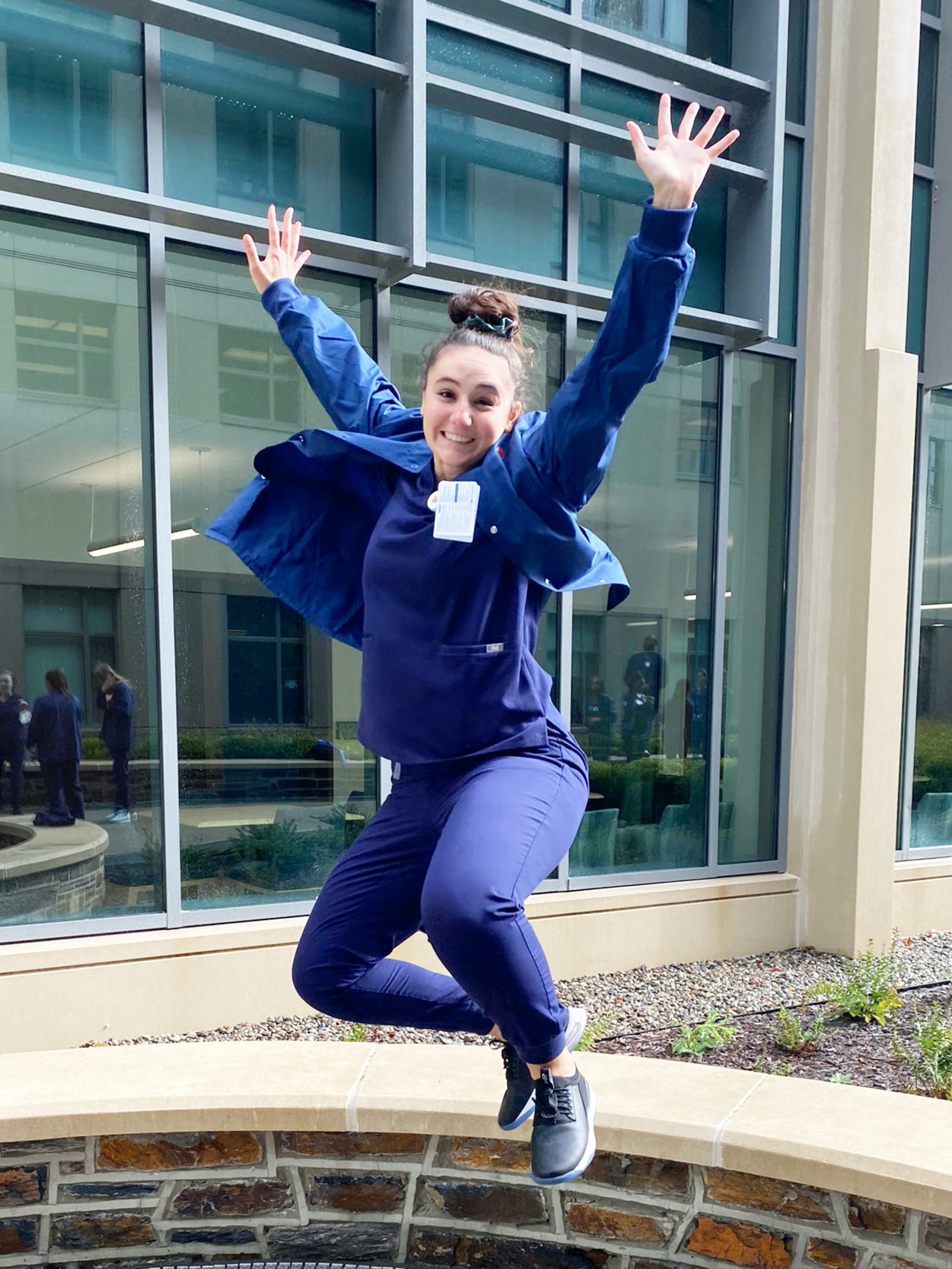 Lauren jumps and smiles
