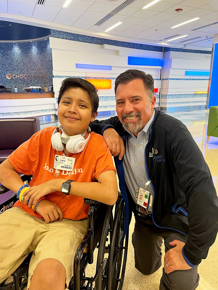 Kenny and Dr. Knight smile at CHOC Hospital in Orange